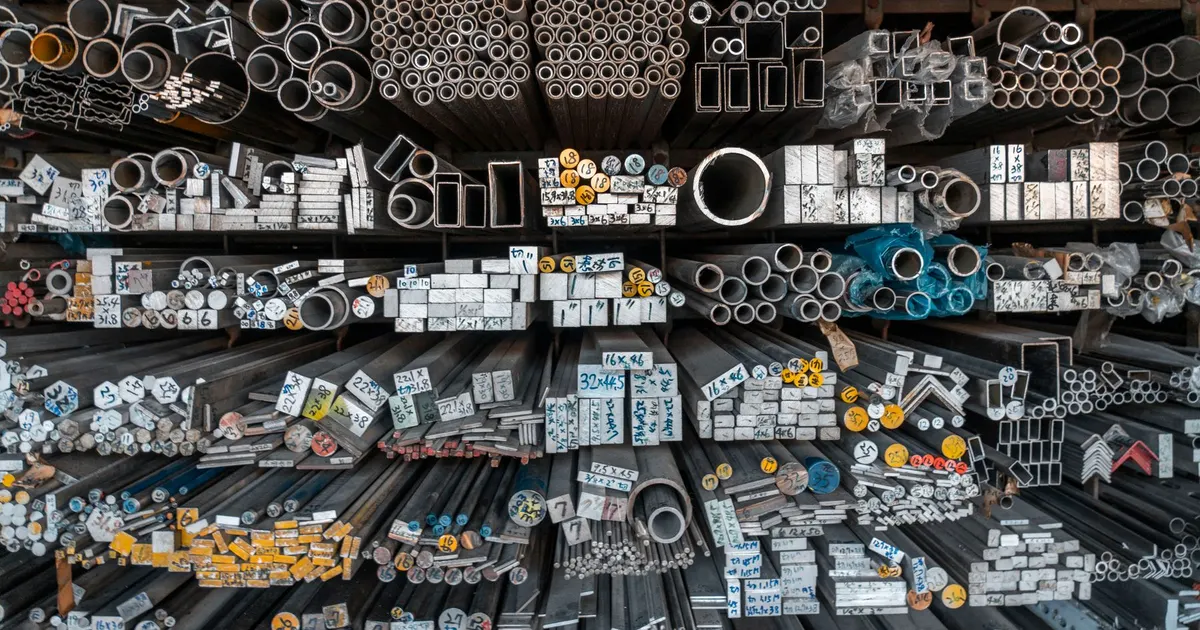 Warehouse racks of metal bar, tube and profile stock, the stock form for 7075 and 6061 machined parts